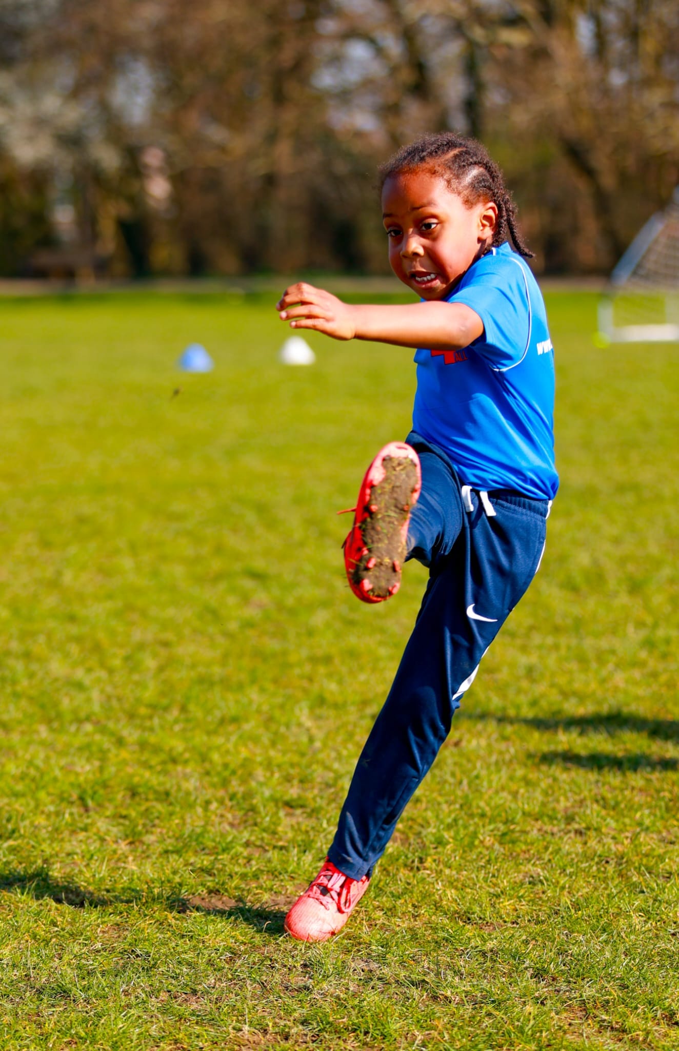 Young player strikes the ball