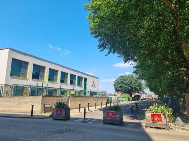 Planters blocking traffic for school street outside Twin Oaks primary school.