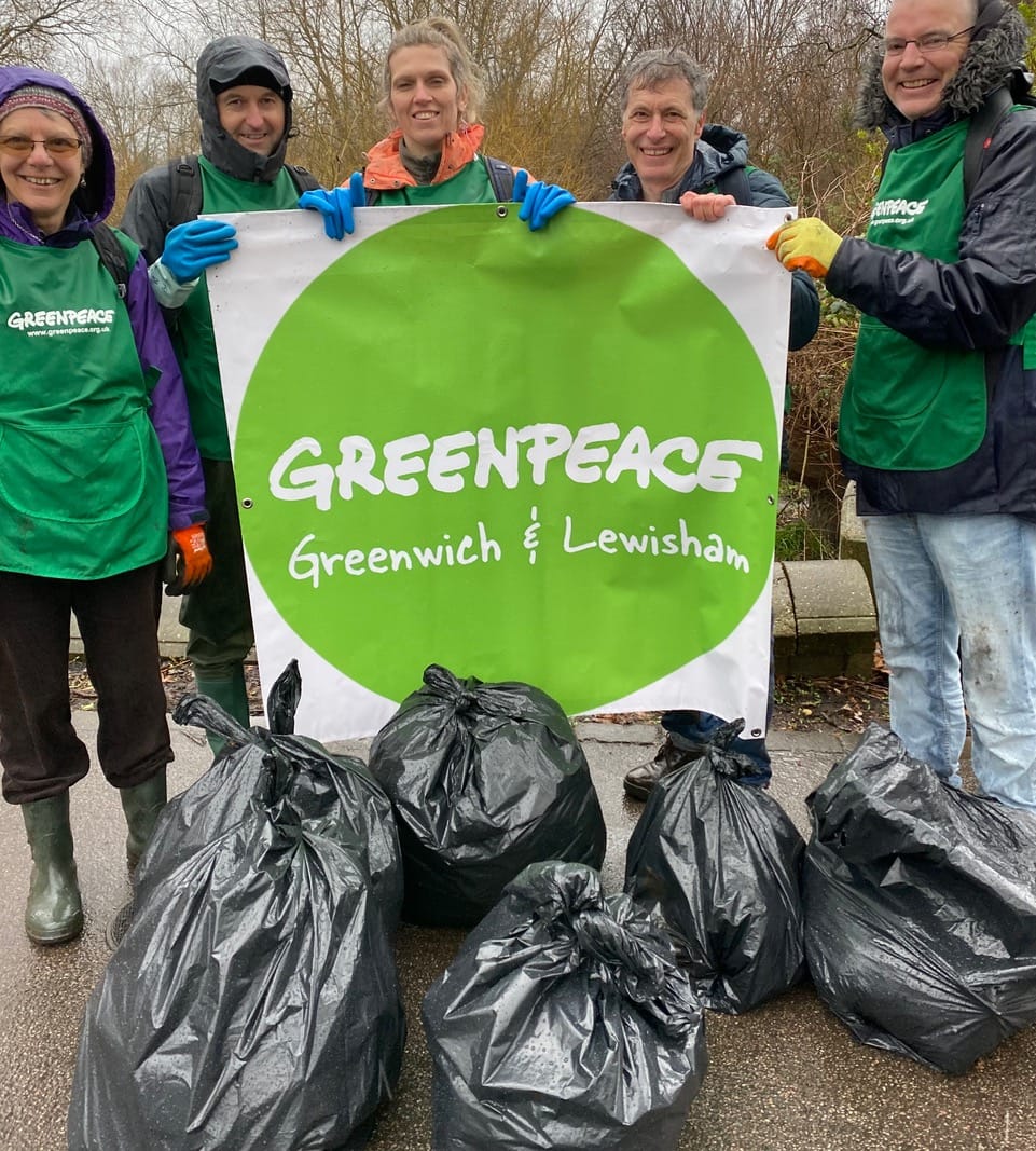 Greenpeace volunteers with bin bags after litter pick in Brookmill Park