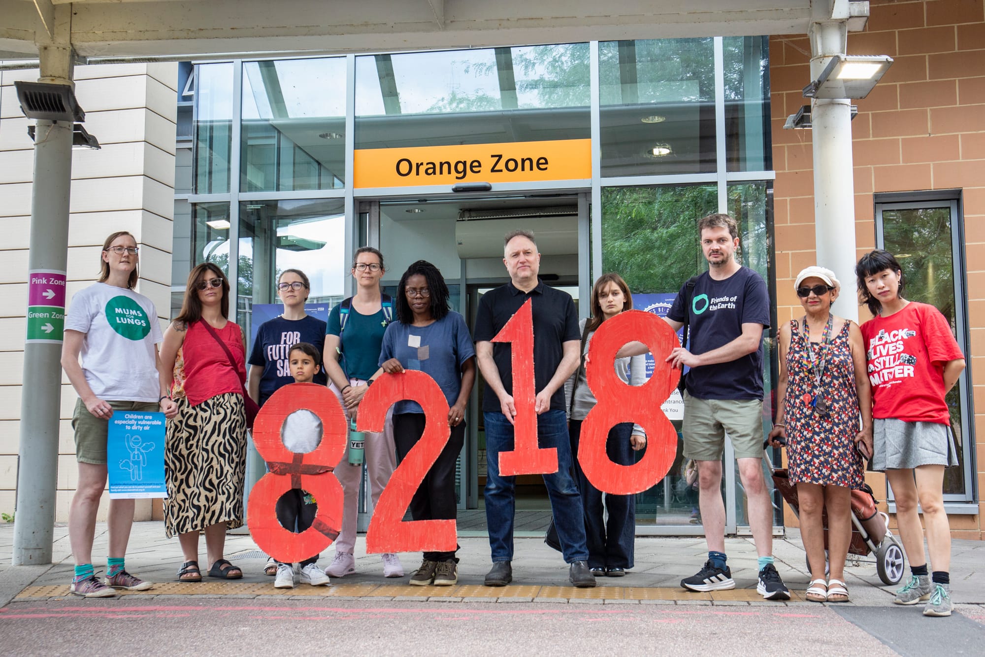 Campaigners at Lewisham hospital holding the numbers 8218