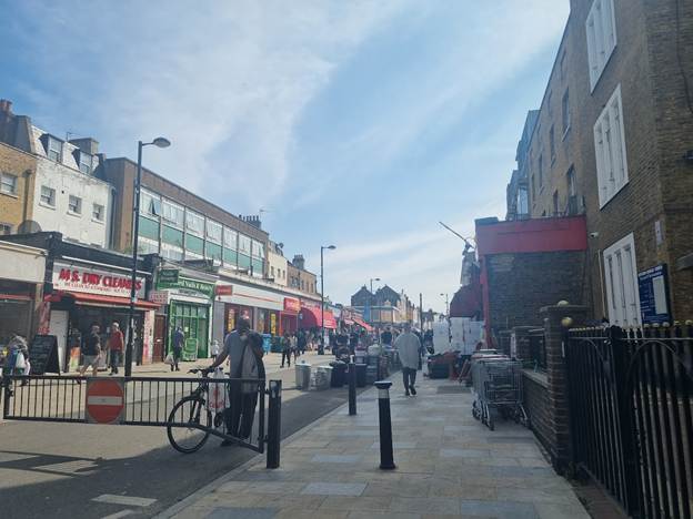 Deptford High Street on market day, with gate preventing through traffic.