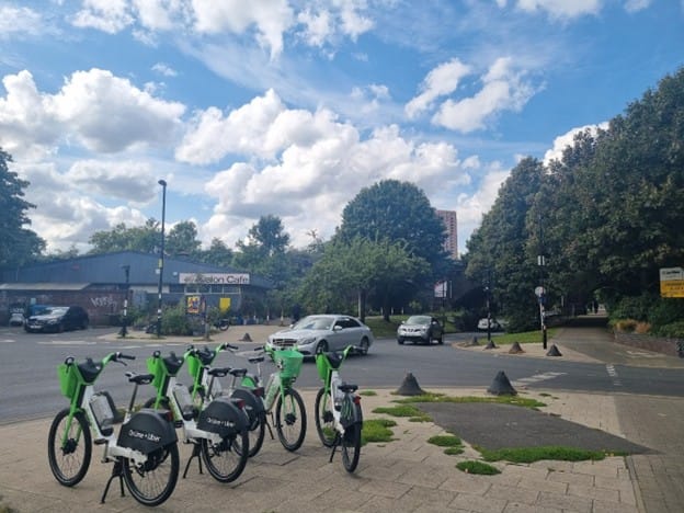 Open industrial estate, Avelon café in background, rental bikes in foreground.