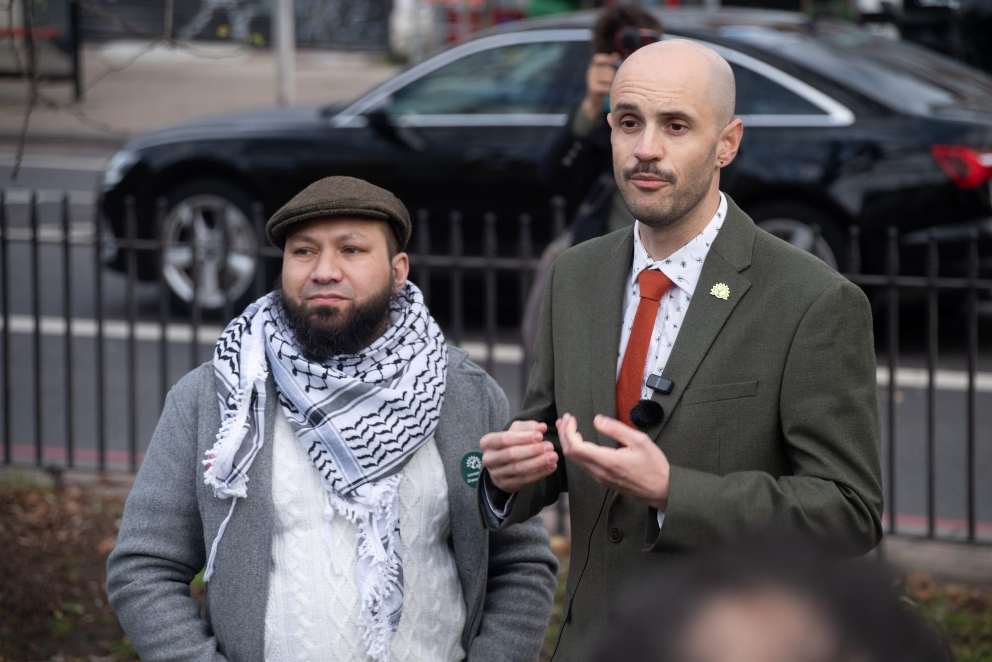 Mothin Ali and Liam Shrivastava speaking at the outdoor event.