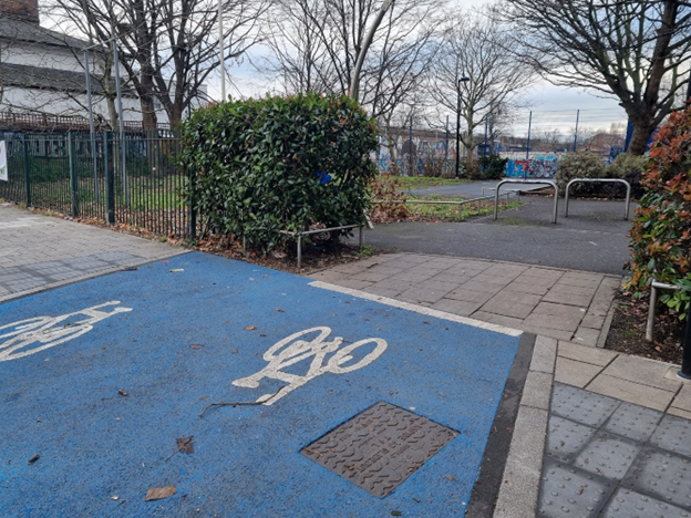 Southern end of new link at Brimmington Park, blocked with shrub on one side, and showing barriers on the other.