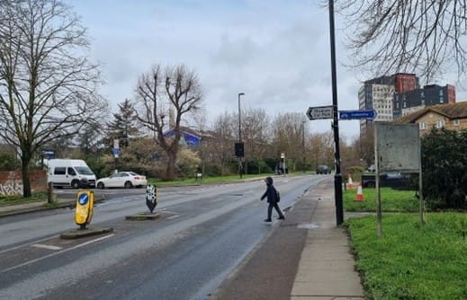 Small child crossing Sanford Street alone, on way to reach Cold Blow Lane. No crossing to slow cars.