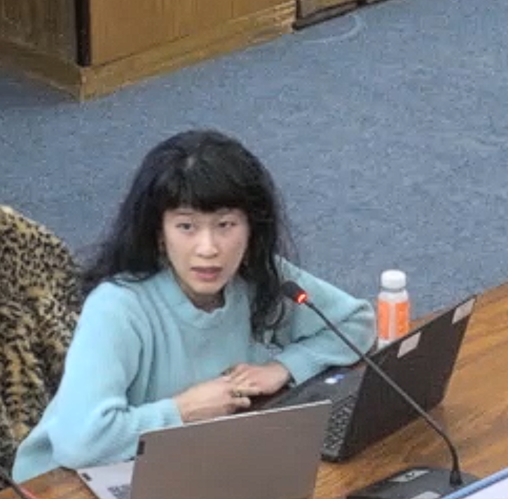 Hau-Yu Tam speaks at the meeting.