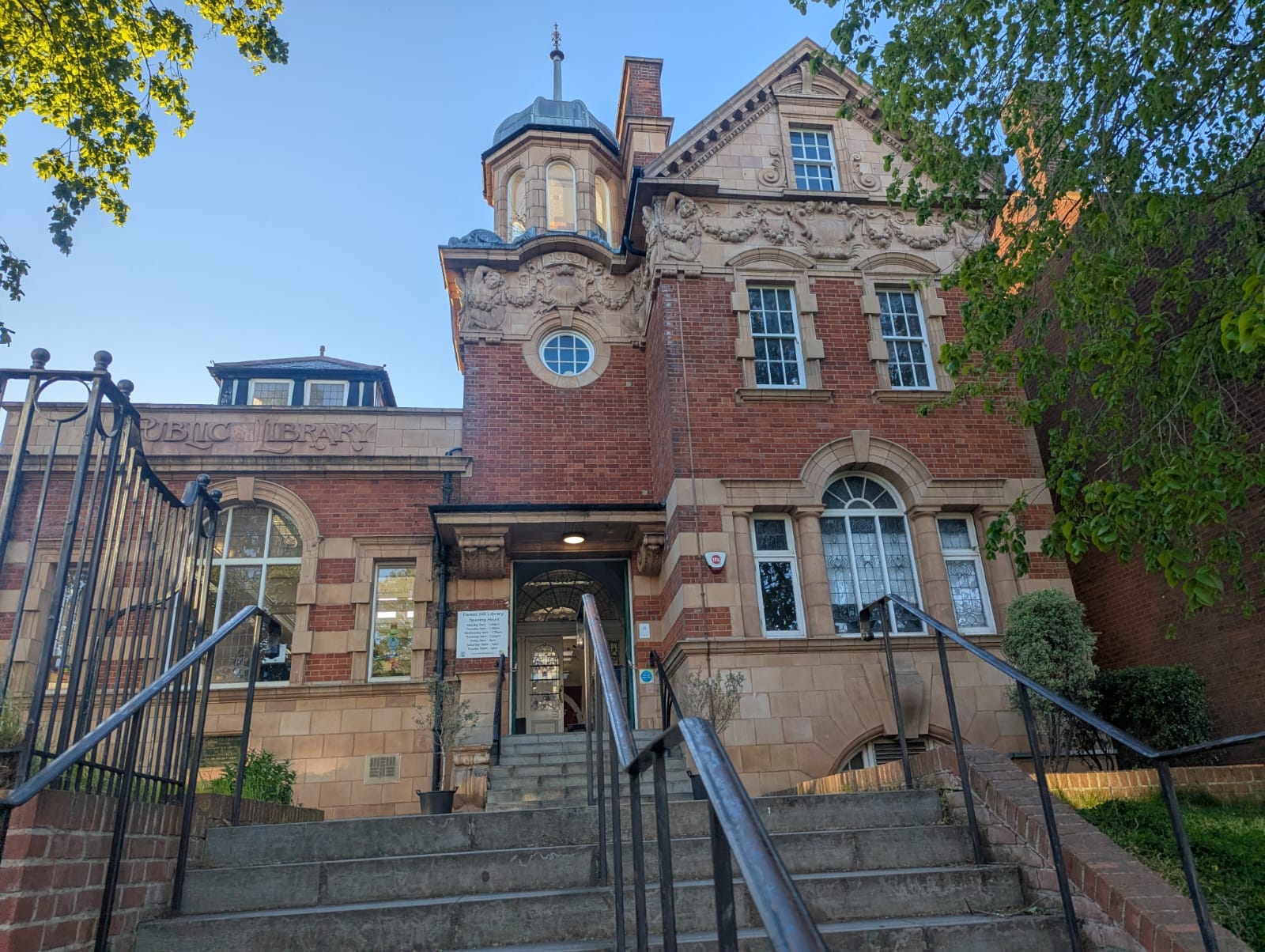 Forest Hill library - red brick Victorian building, with words "Public Library" in stucco. 