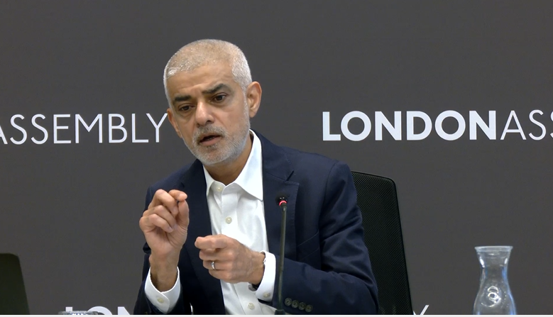 Sadiq Khan speaking at a meeting. 