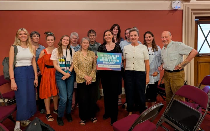 Constituents with Vicky Foxcroft holding sign "I'm taking action to tackle the climate and nature emergency".
