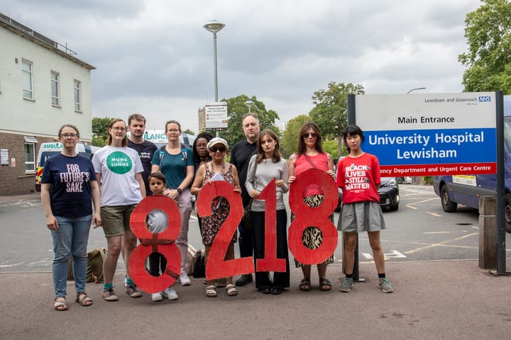 Campaigners at Lewisham hospital holding the numbers 8218