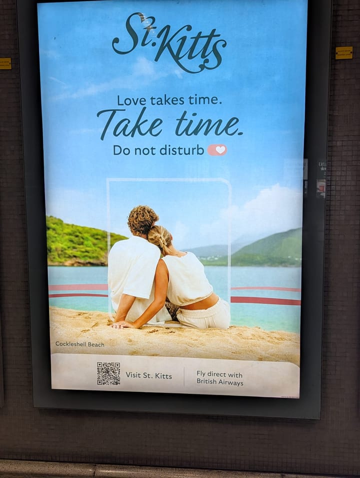 Couple on beach with caption "St Kitts, Love takes time, do not disturb" and "Fly direct with British Airways".