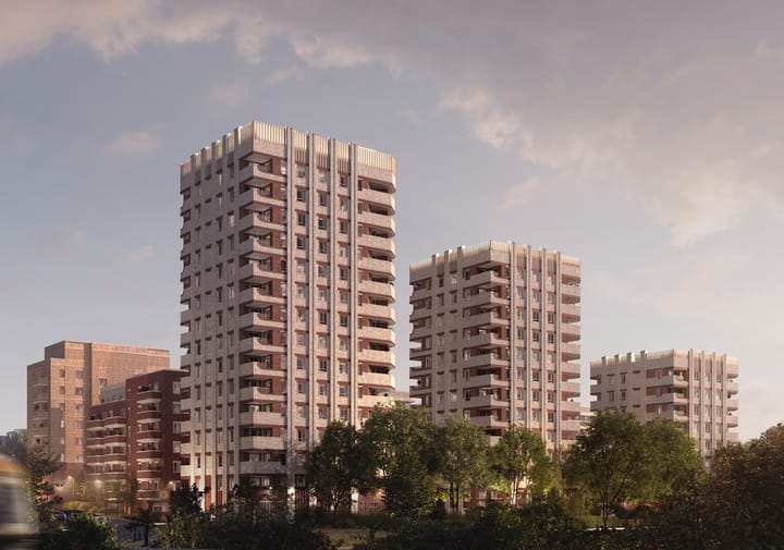CGI view of three tower blocks with housing behind, looking south west from rail lines.