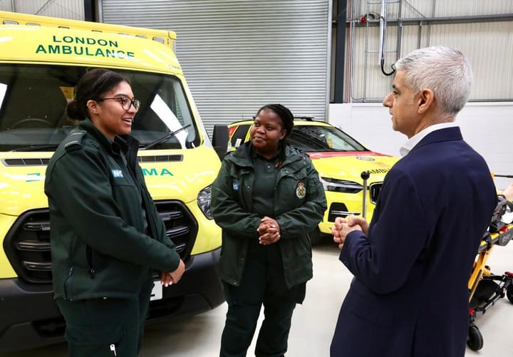 Sadiq Khan speaking with 2 paramedics from London Ambulance Service, ambulance in the background. rkers