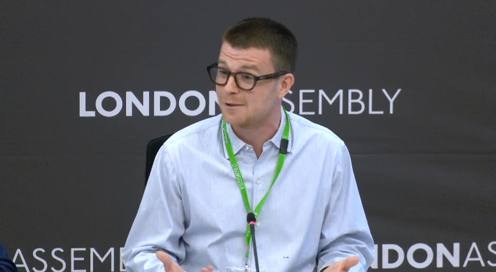 Sam Bloomer speaking at London Assembly meeting. 