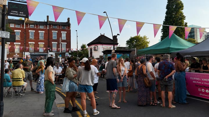 Visitors browse food stalls at the pedestrianised Night Market outside Sydenham Station.