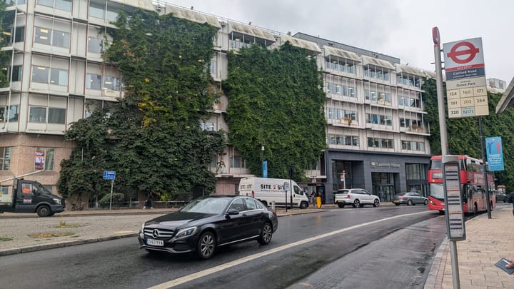 Laurence House in Catford.  Long office block of concrete and glass at edge of the south circular road, heavy traffic..